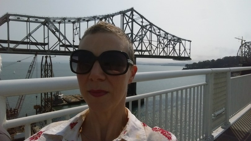 Walking west on the new Bay Bridge, while the old one is torn apart, cast away...